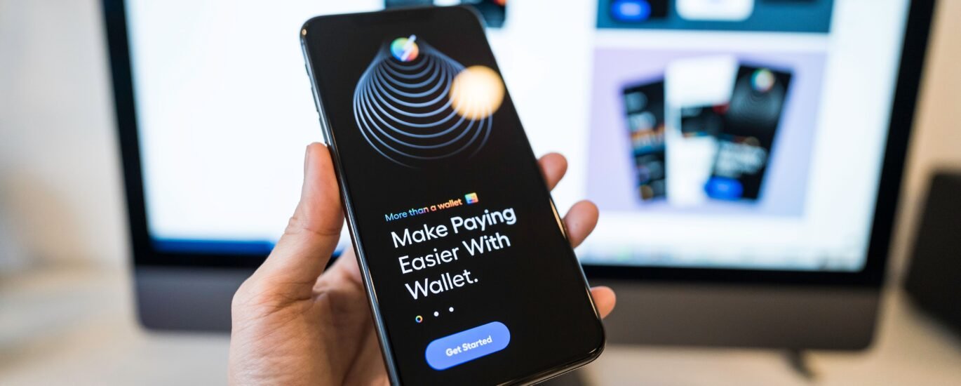 Person holding smartphone with a digital wallet app for DeFi