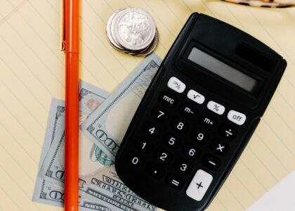 Calculator and coins symbolizing how to calculate crypto gas fees